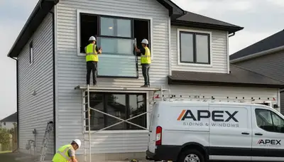 Technician repairing window frame beside vinyl siding home in Las Vegas, NV